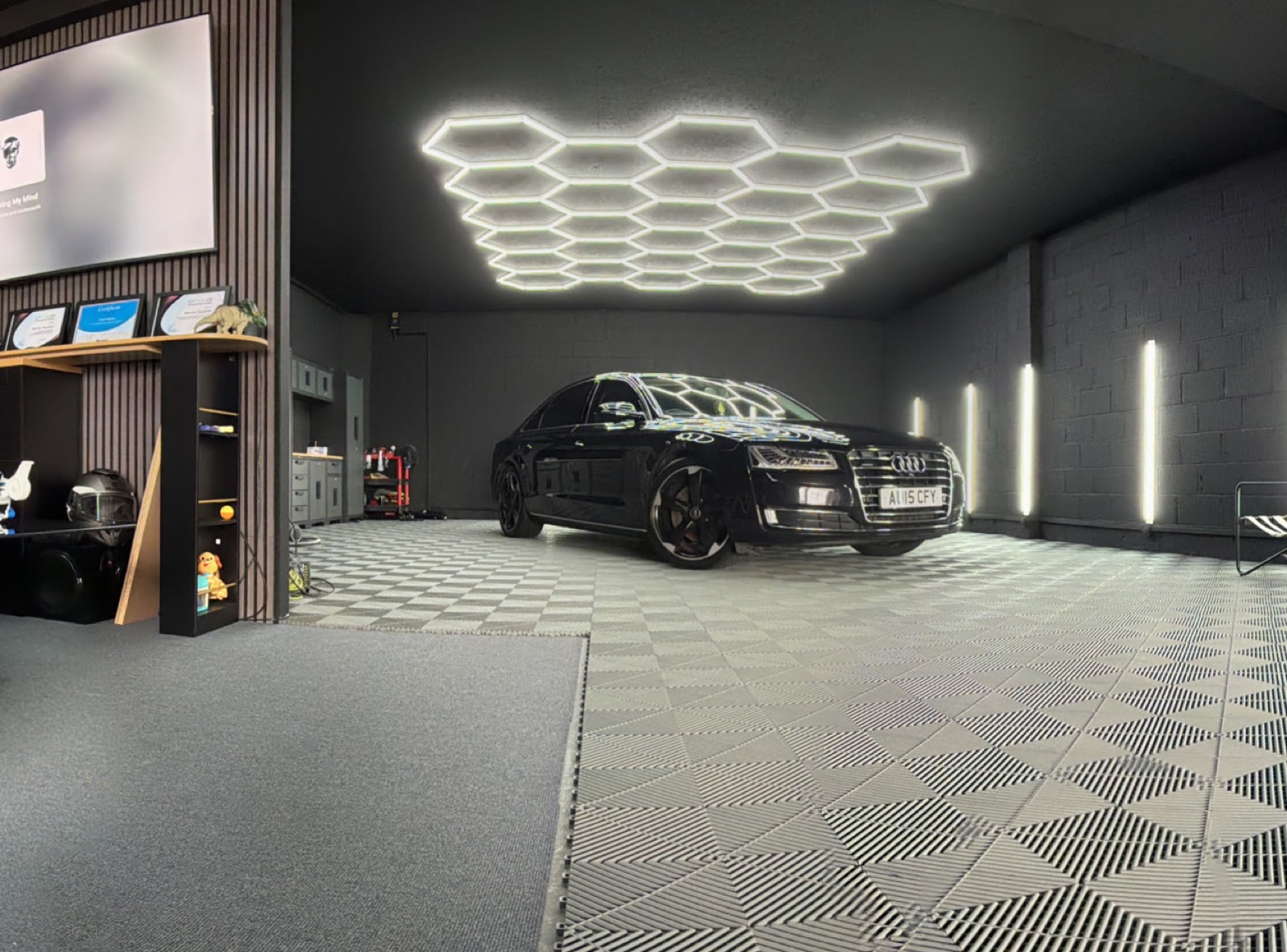 M&M Detailing studio lounge with hexagon lighting and seating